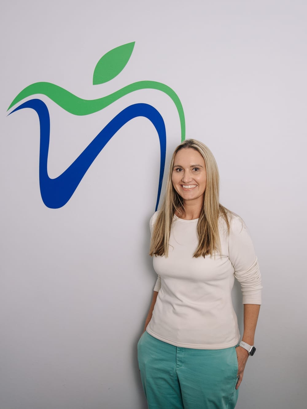 Receptionist at the front desk welcoming patients to Smile Connection Dental Studio, Pretoria
